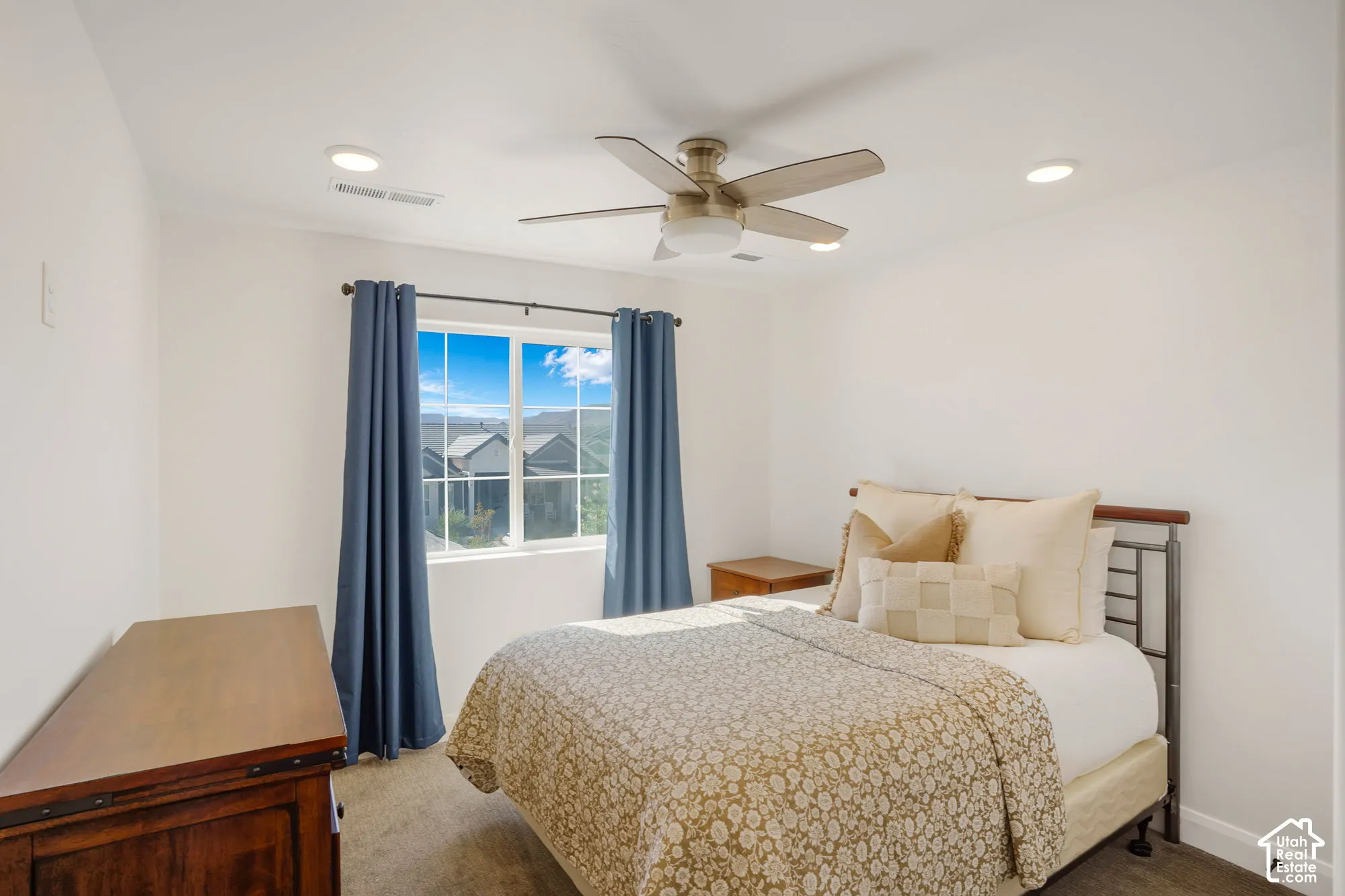 Recessed lighting, ceiling fan, and carpeted flooring