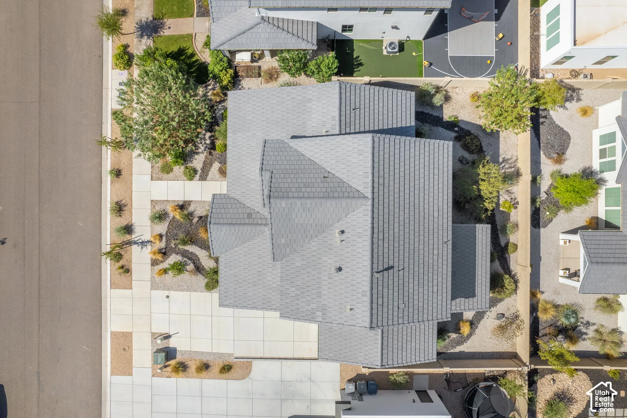 Pitched roofline, extensive paved areas, and structured landscaping