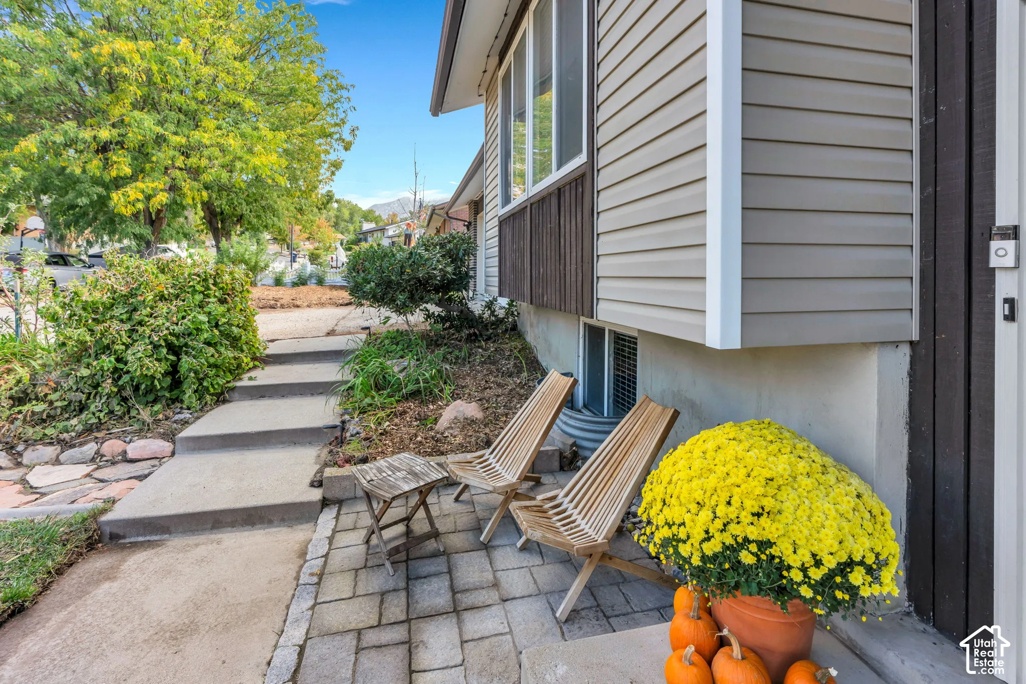 Exterior featuring horizontal siding, dark vertical wood paneling, and concrete foundation
