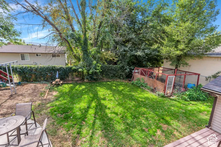 Manicured lawn area with mature trees providing shade