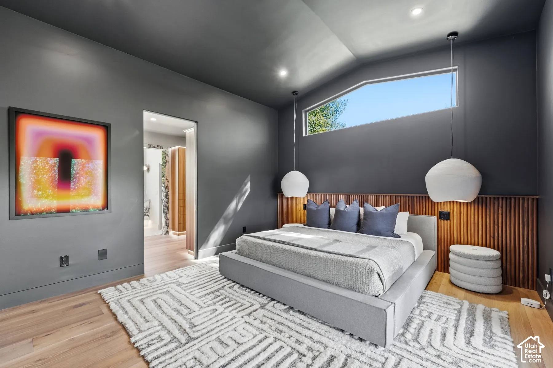Hardwood-finish flooring with a dark accent wall
