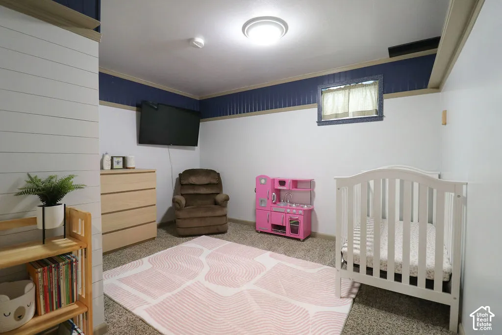 Recessed window with white trim, built-in wall paneling, and overhead lighting