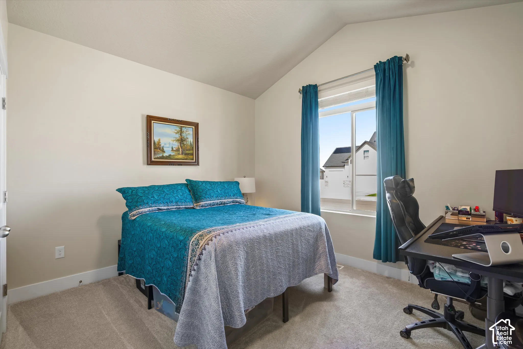 Vaulted ceiling, carpeted flooring, and a window with blinds