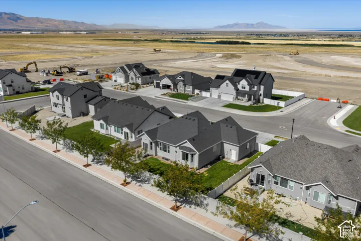Newly constructed residential community with paved streets, sidewalks, and established landscaping