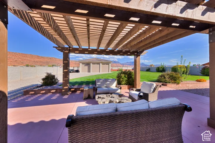 Expansive wood pergola covering a paved patio