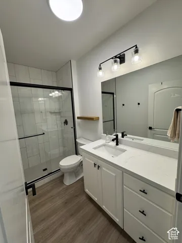 White single vanity with stone countertop, undermount sink, and matte black faucet
