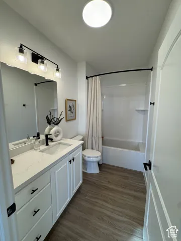 White vanity with a quartz-finish countertop and undermount sink