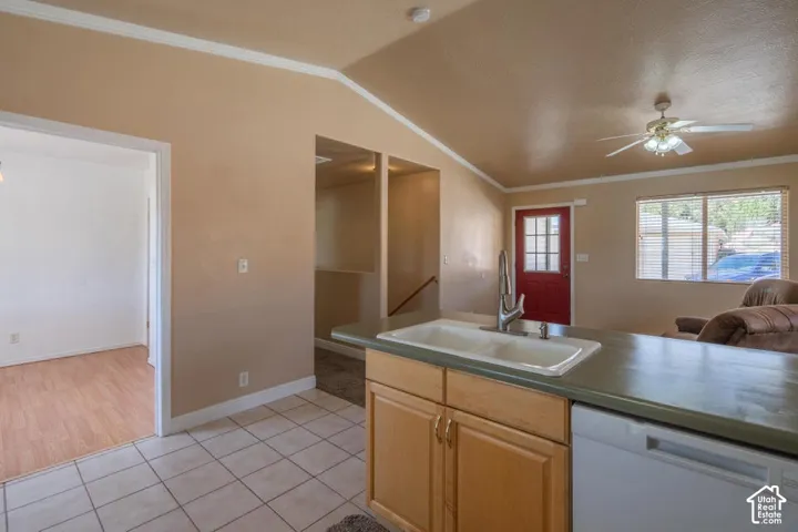 Kitchen peninsula with a double basin sink and a modern faucet