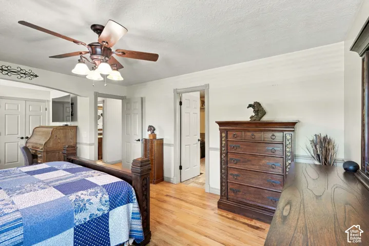 Wood-finish flooring with white walls and trim