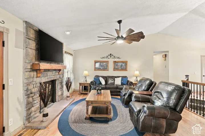Stone-faced fireplace with a wood mantel