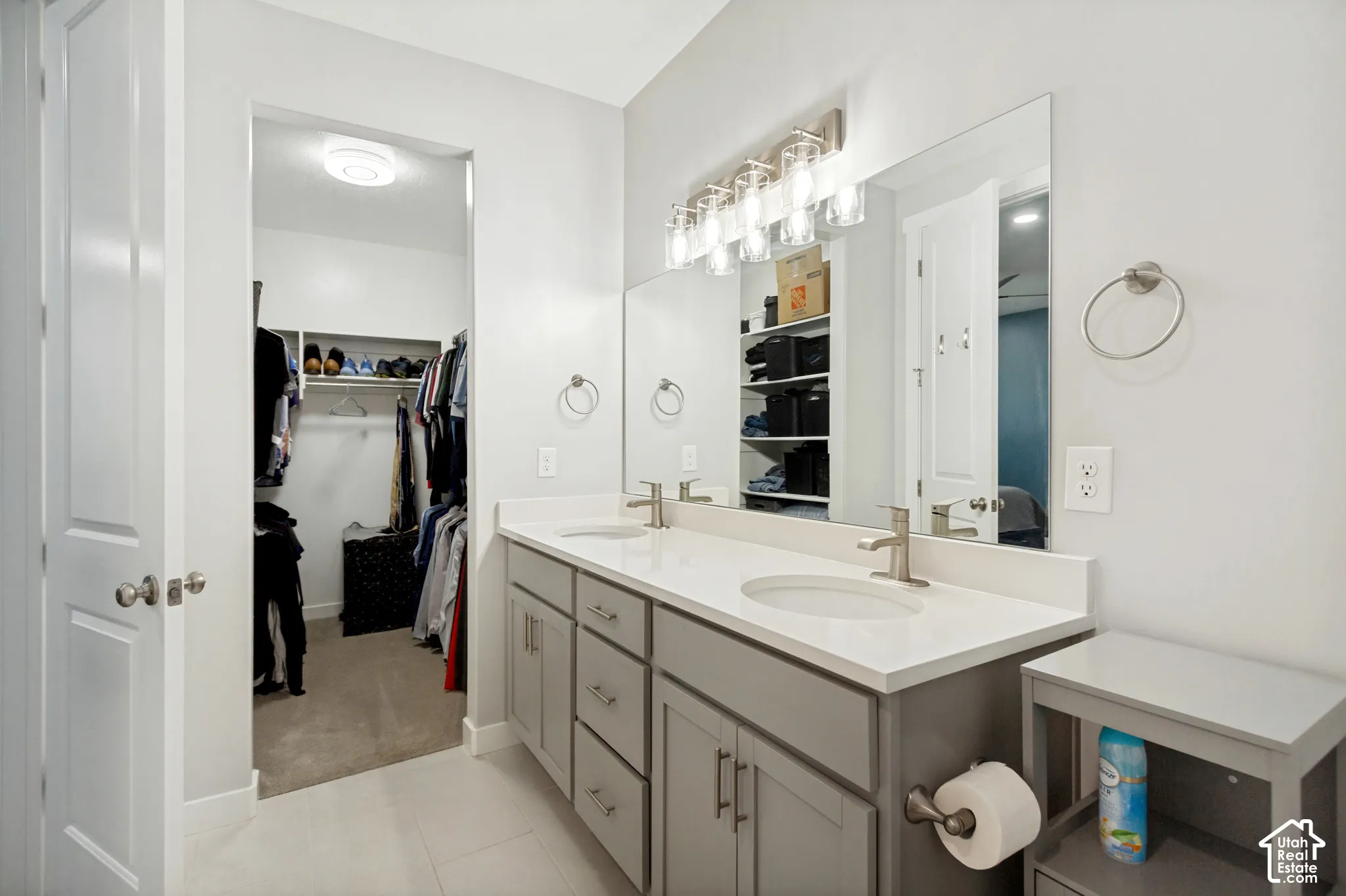 Double vanity with white countertop and integrated sinks