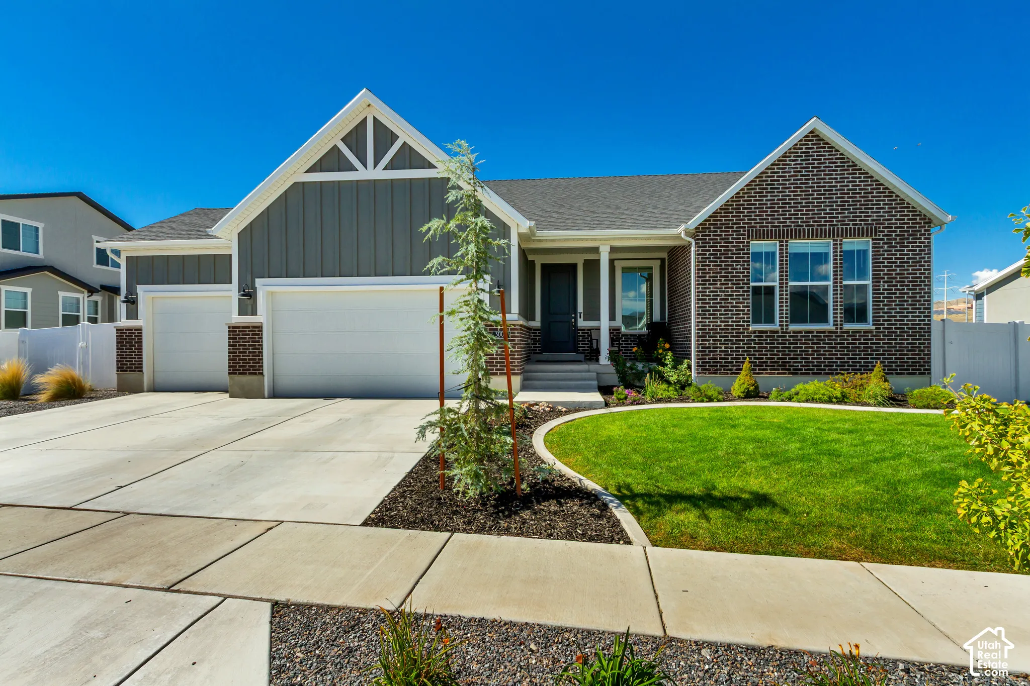 Brick and siding exterior with gabled architectural details