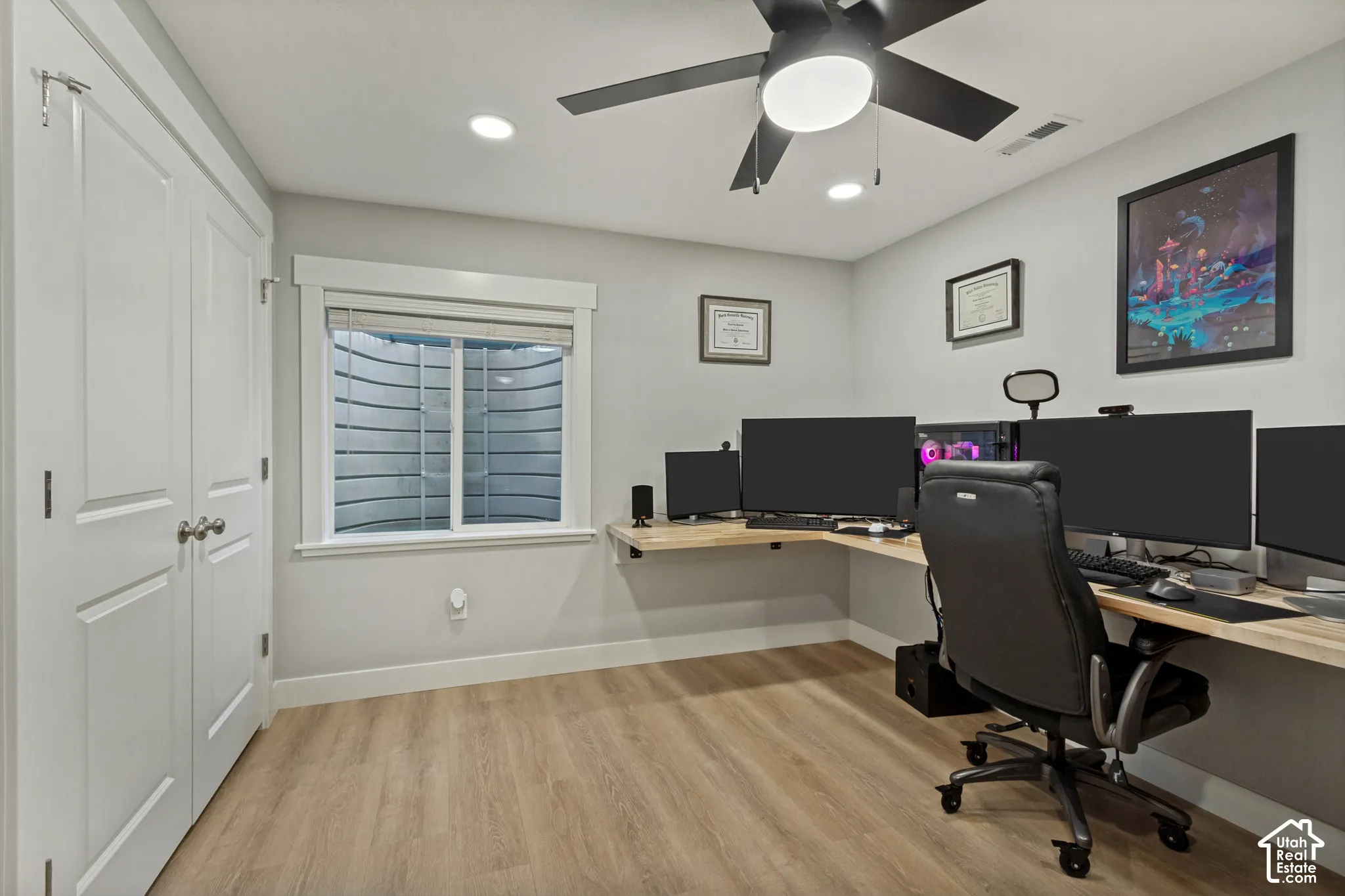 LVP flooring, recessed lighting, and a ceiling fan with light