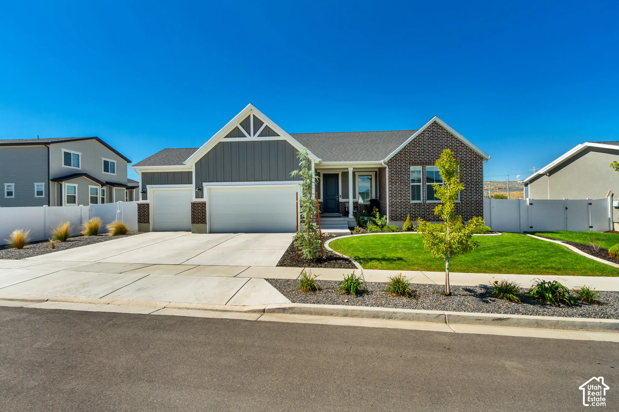 Brick and siding exterior with a gabled roofline
