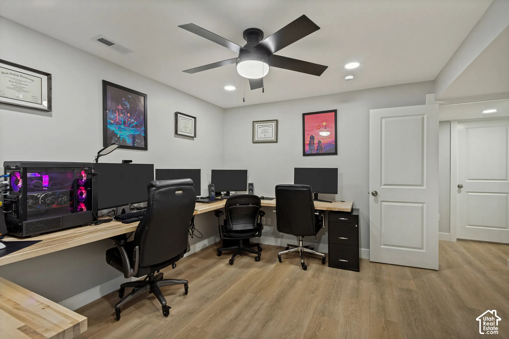 Spacious interior with neutral wall tones, LVP flooring, recessed lighting, a ceiling fan, and white panel doors