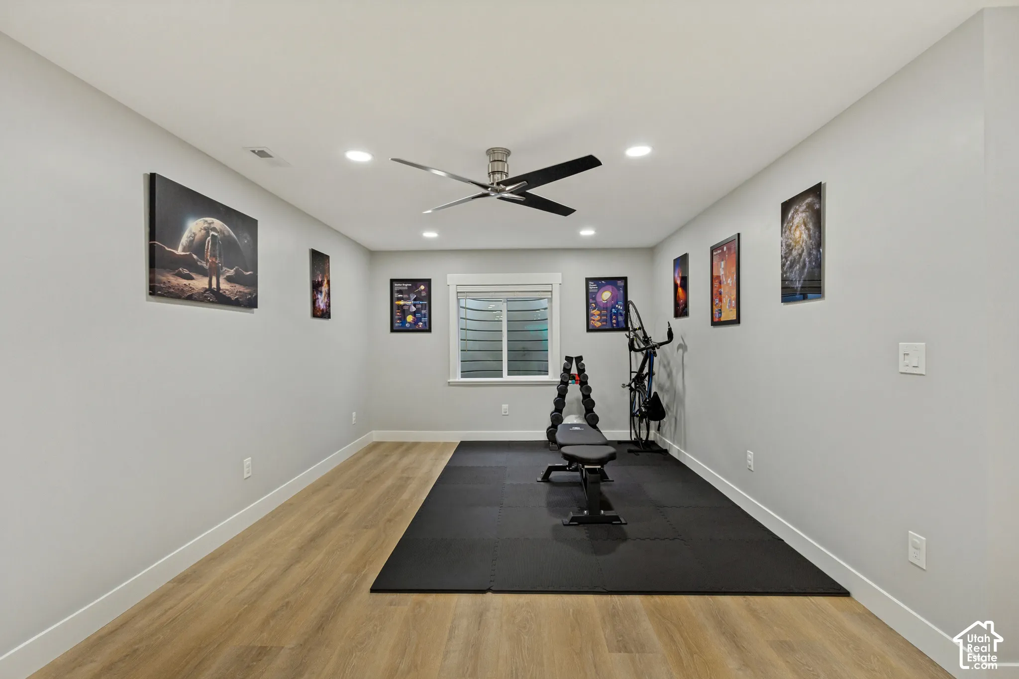 Recessed lighting, ceiling fan, LVP flooring, and a single window