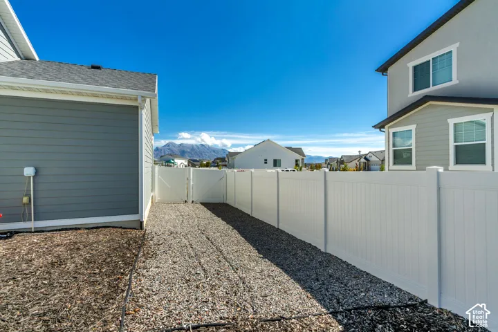 White vinyl fencing enclosing a gravel pathway