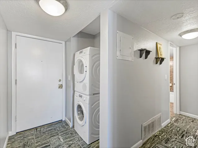 Stacked washer and dryer units