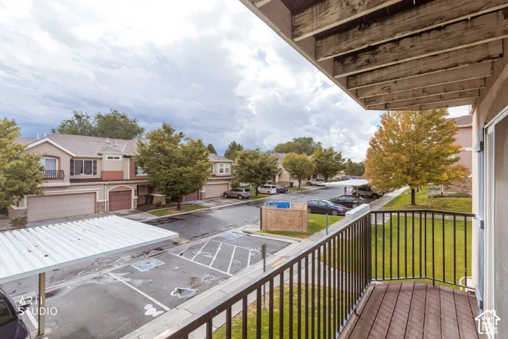Balcony with composite decking and black metal railings