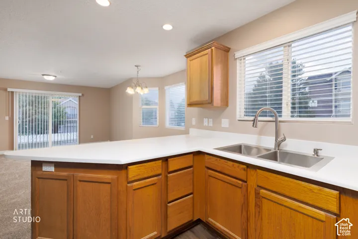 Kitchen island with a white countertop and wood-finish cabinetry