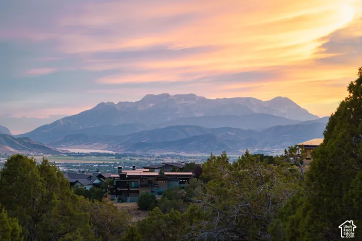 Mountain backdrop with distant body of water