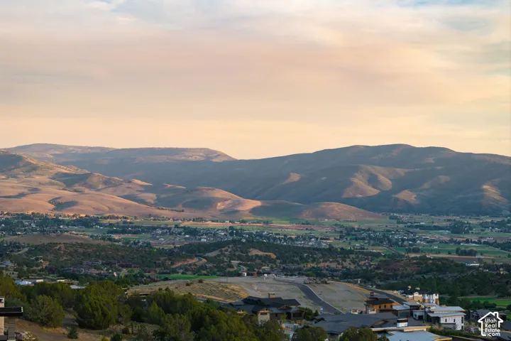 Mountainous backdrop with a distant valley and developed residential areas