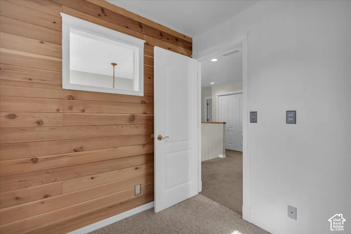 Wood-paneled wall accent with white trim