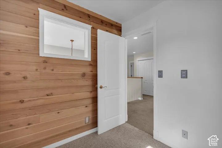 Wood-paneled wall accent with white trim