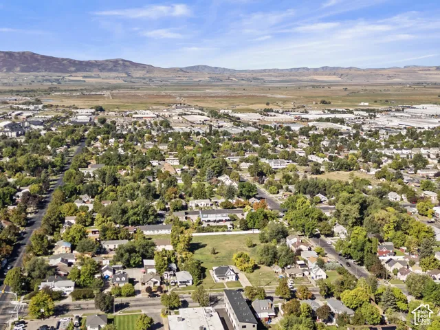 Expansive aerial perspective showcasing a developed residential area with numerous mature trees