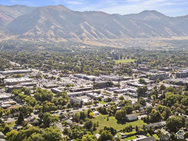 Expansive mountainous backdrop framing a developed urban landscape