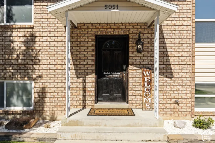 Brick exterior with a covered front entrance