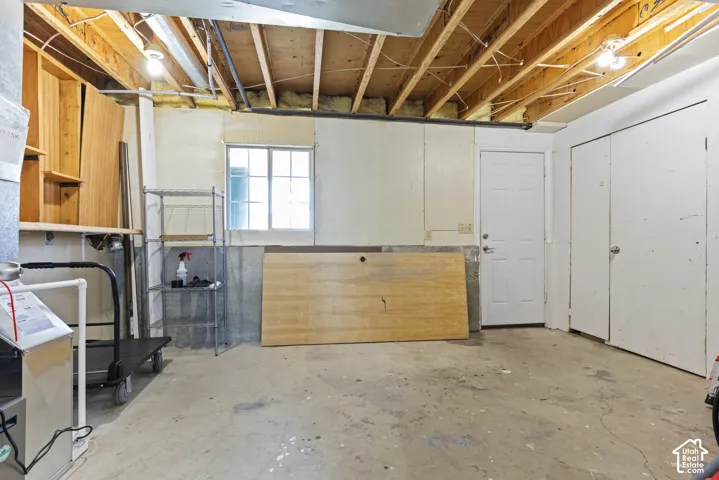 Concrete flooring with exposed ceiling joists