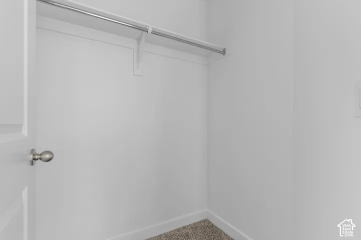 Built-in closet shelving with a hanging rod