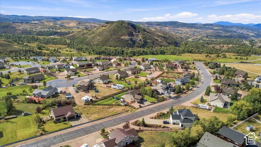 Expansive residential area featuring established homes, paved streets, and abundant surrounding greenery