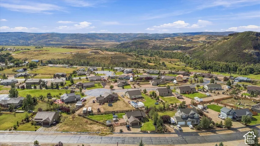 Expansive residential area with a mountainous backdrop and clear skies