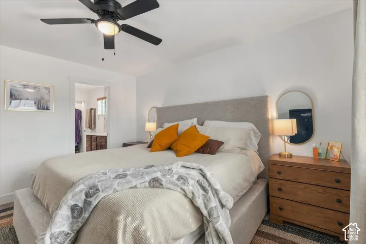 White walls with a black ceiling fan