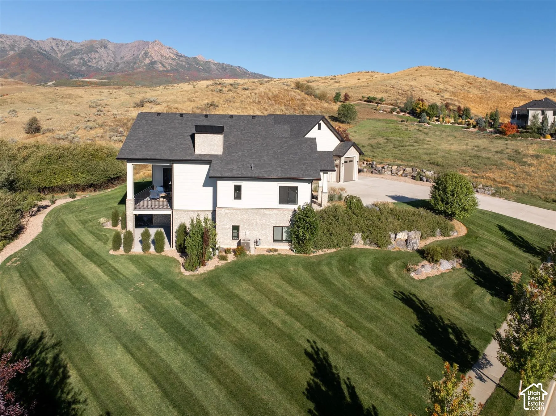 Contemporary two-story residence with a multi-level stone and siding exterior