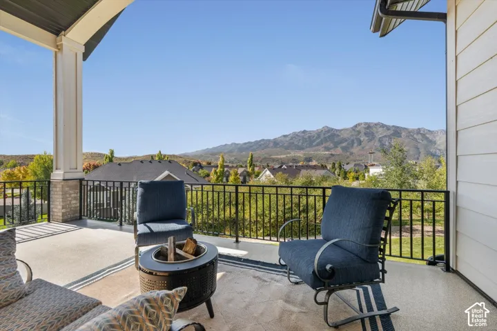 Covered outdoor patio with a mountain backdrop
