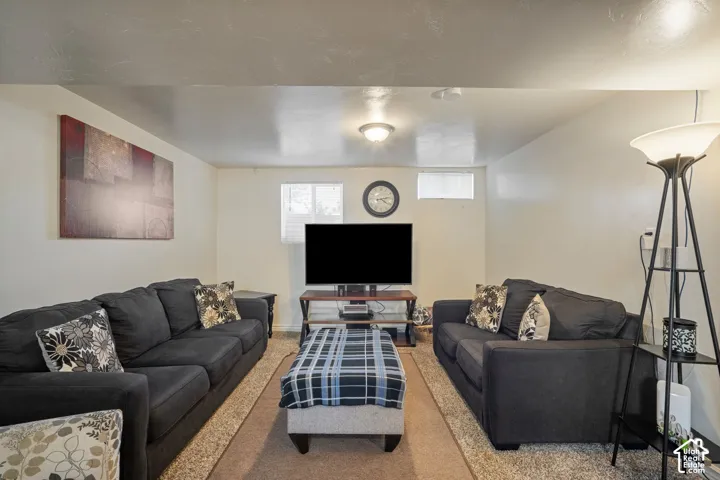 Recessed lighting, light wall finishes, and a flush-mount ceiling fixture