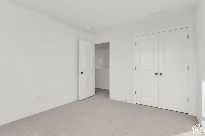 Another view of bedroom with double closet doors.