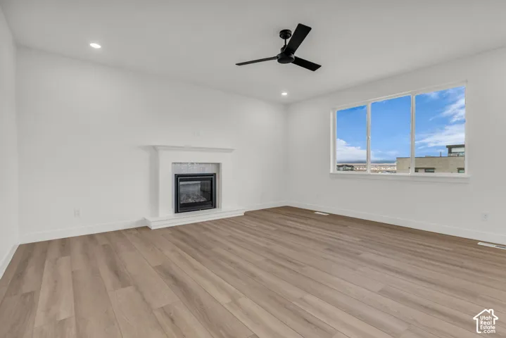 Spacious great room with large windows, gas fireplace and hard flooring on the entire main floor.
