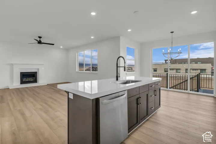 Open-concept main living area with a fireplace, with large windows across the living space with beautiful open views.