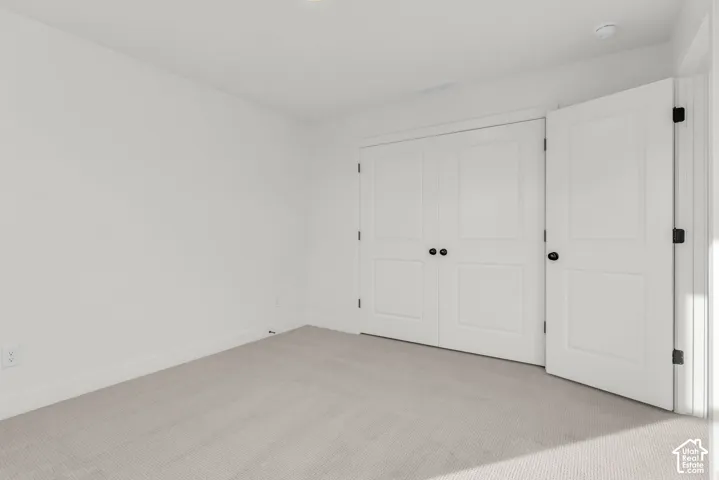 Another view of bedroom with double closet doors.