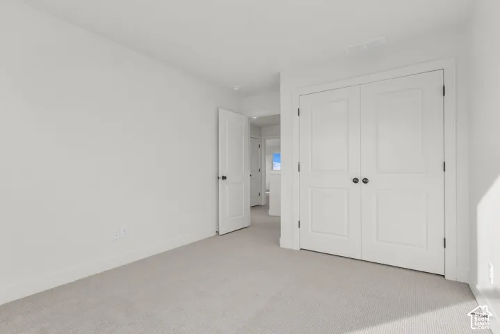 Another view of bedroom with double closet doors.