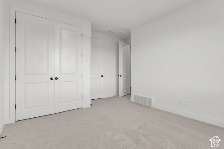 Another view of this main floor guest suite with double closet doors.