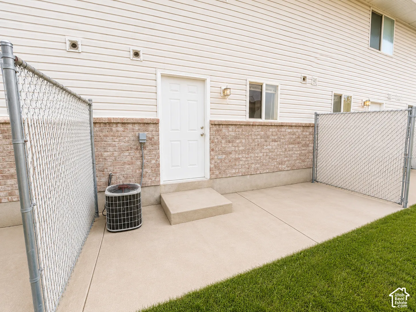Concrete patio with chain-link fencing