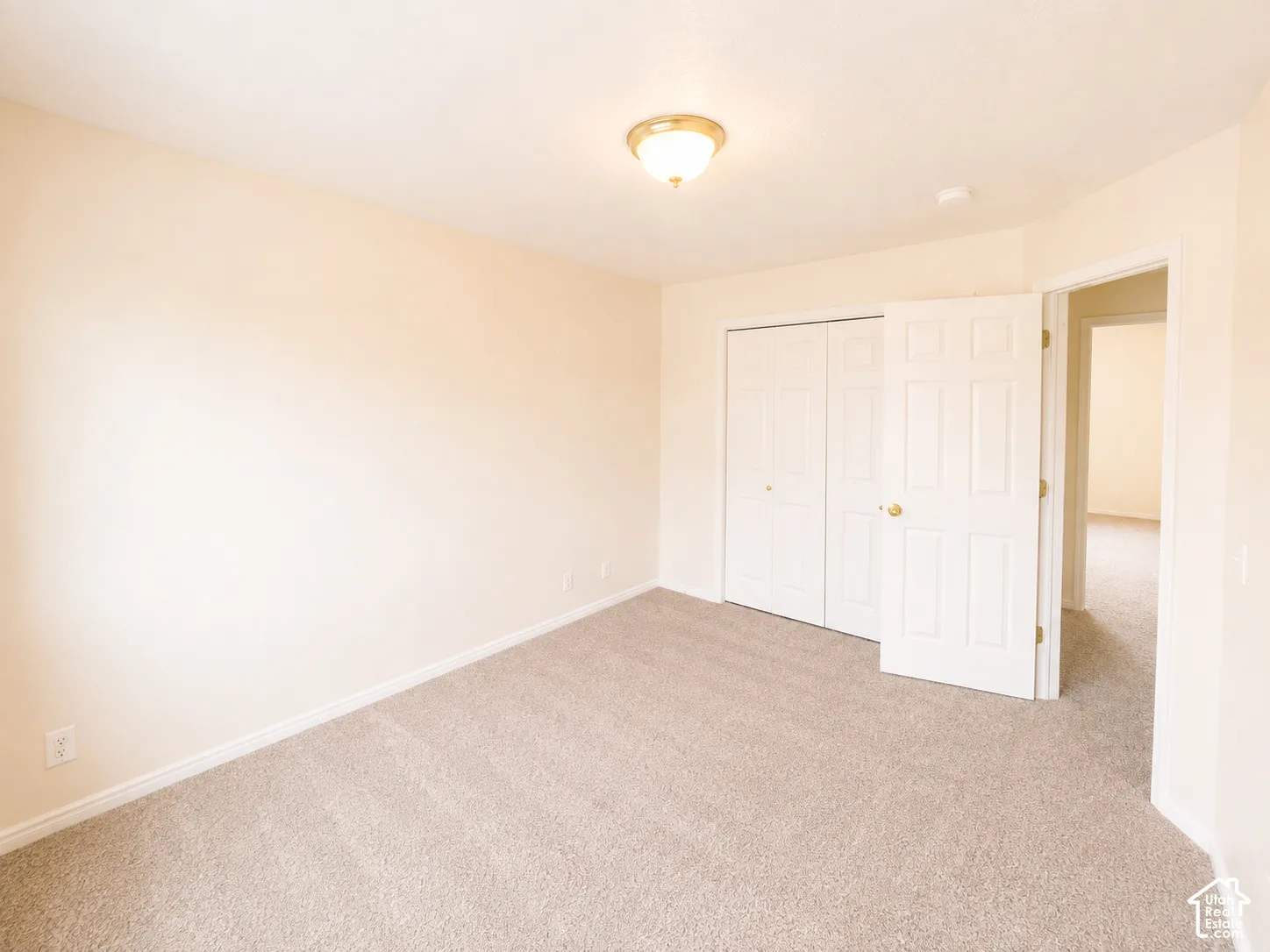 Neutral-toned carpeting throughout with light-colored walls