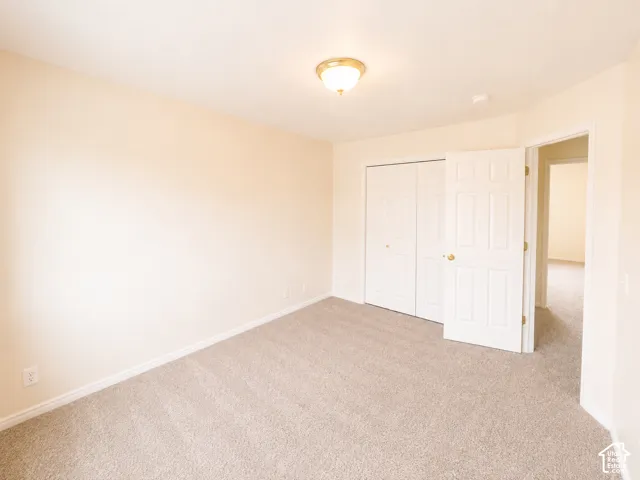 Neutral-toned carpeting throughout with light-colored walls