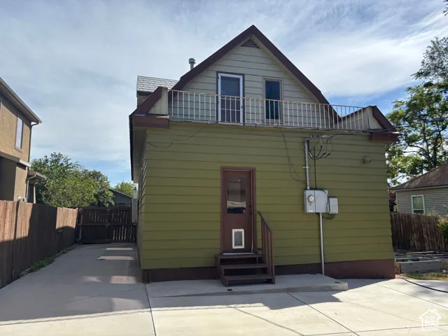 Green horizontal siding with brown trim