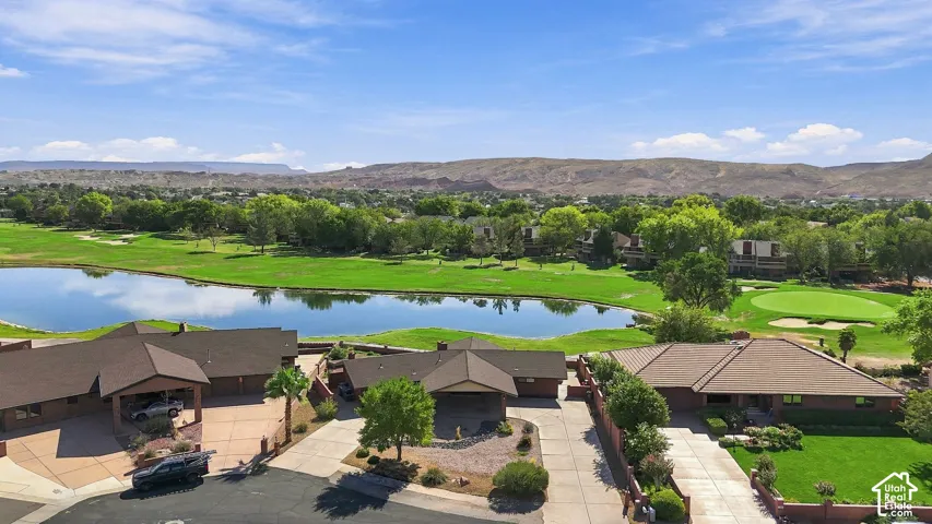 Expansive grounds featuring manicured lawns, mature landscaping, and serene water features